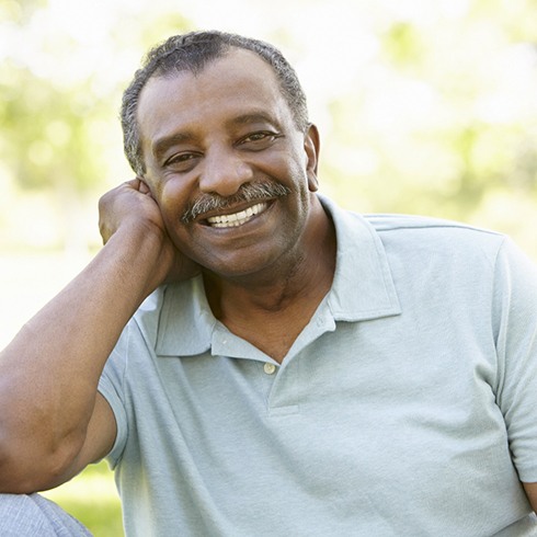 Senior man smiling outdoors