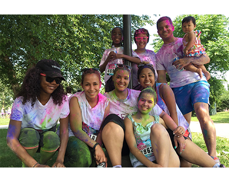 Dental team members covered in paint after a fun run event