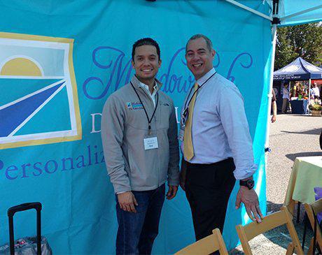 Two Mineola dentists at community event