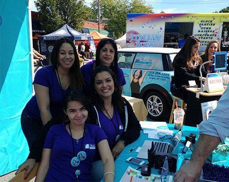 Four Meadowbrook Dental Care team members at community event