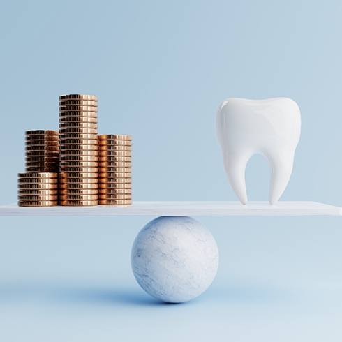 Illustrated balanced scale with model of tooth on one side and pile of coins on the other