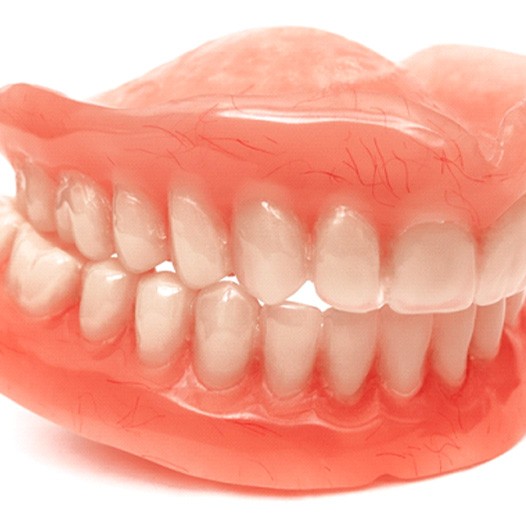 Close up of a set of full dentures in Mineola