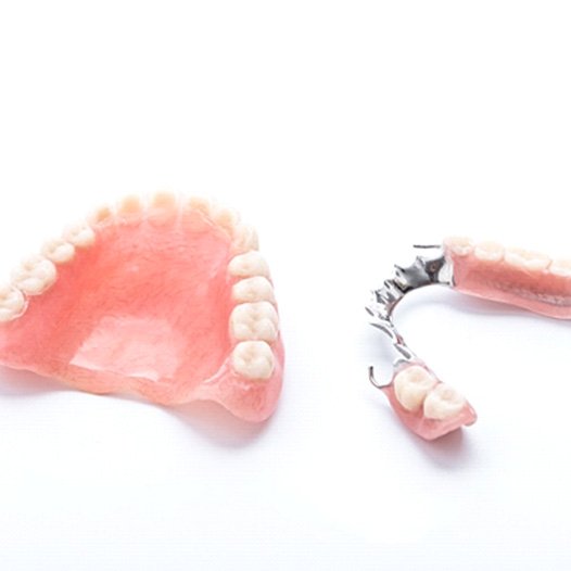 A full denture next to a partial denture