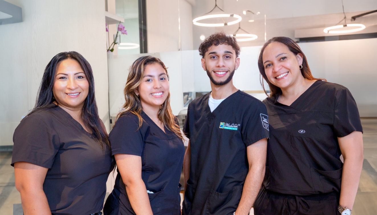 Four smiling dental team members at Meadowbrook Dental Care