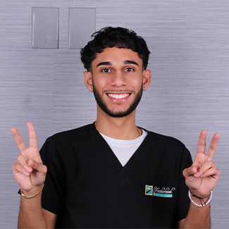 Dental Assistant Angel making peace signs with both hands