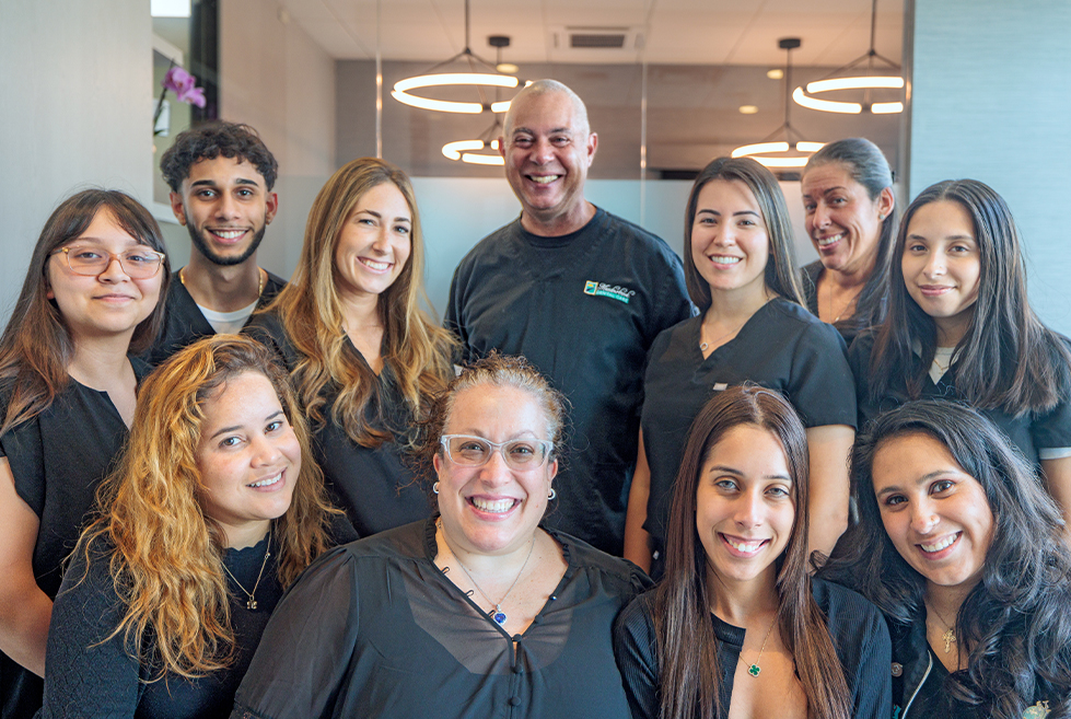 Smiling Mineola dental team members at Meadowbrook Dental Care