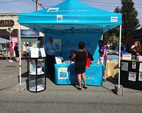 Meadowbrook Dental Care team at outdoor information booth