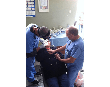 Dentists treating dental patient on mission trip