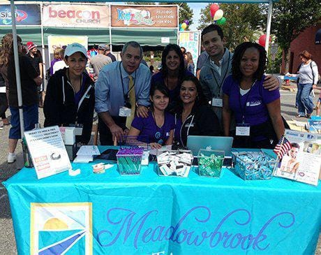 Medwobrook Dental Care booth at community event in parking lot