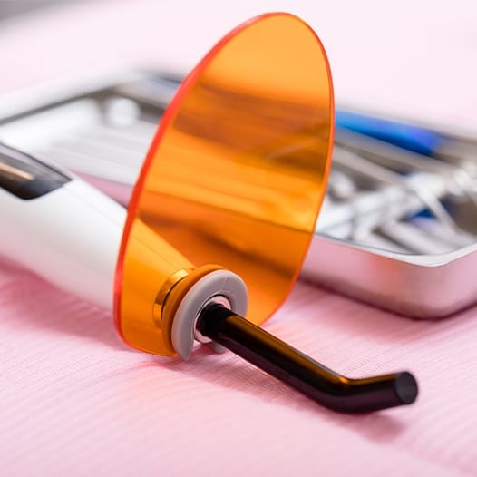 Close up of row of dental instruments on table