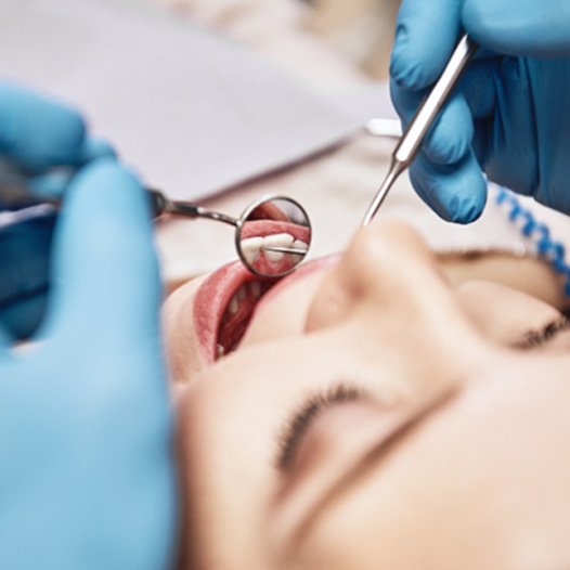 Dentist giving a patient a dental exam