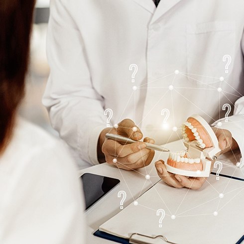 Patient learning about dental implants in Mineola