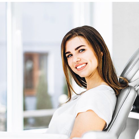 Young woman smiling in dental chair