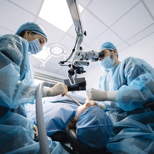 Dentist and assistant treating a patient