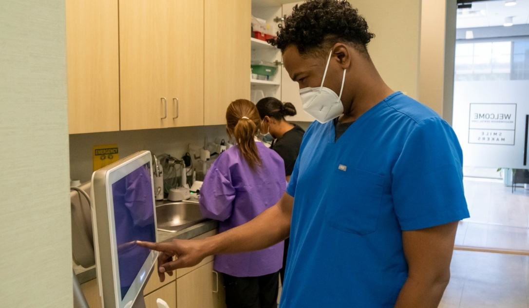 Dental team member capturing intraoral images