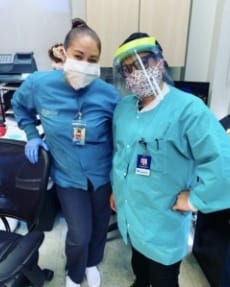 Two dental team member wearing protective face masks
