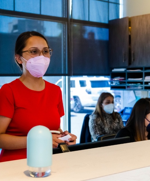 Dental team member ready to help with dental insurance and financing options