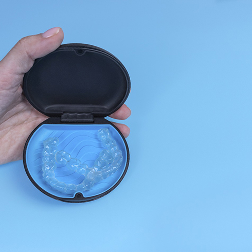 Invisalign in Mineola in blue case