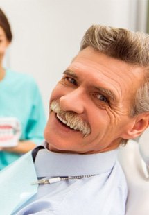 a man smiling with implant dentures near Garden City