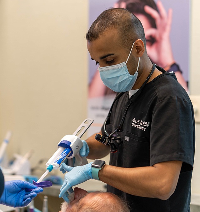 Doctor Casanas treating dental patient