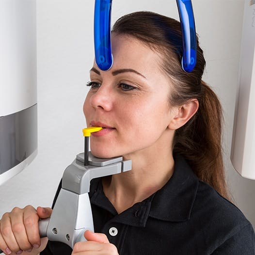 Woman receiving 3 D C T digital x-rays