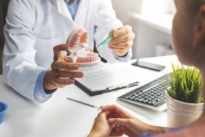 dentist talking to a diabetic patient about dental implants