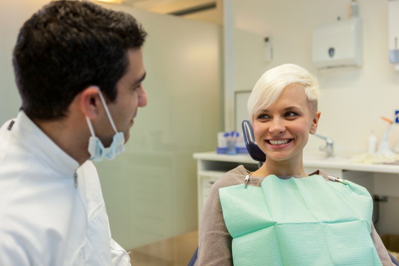 woman learning about types of tooth stains in Mineola