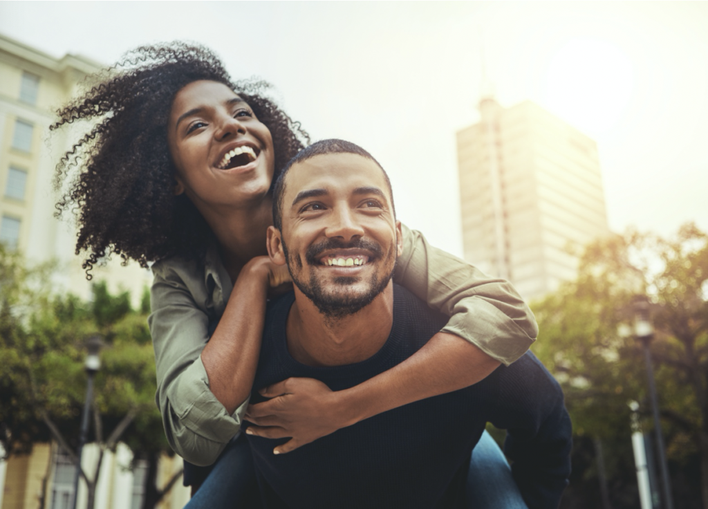 couple smiling in city