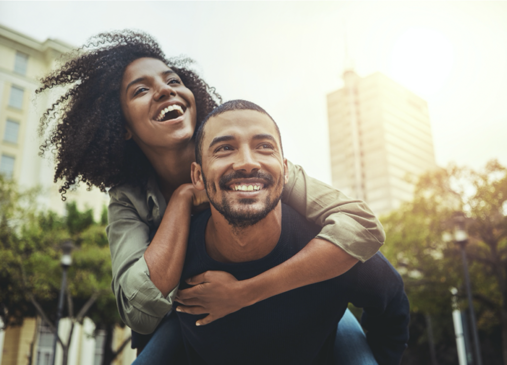 couple smiling in city  