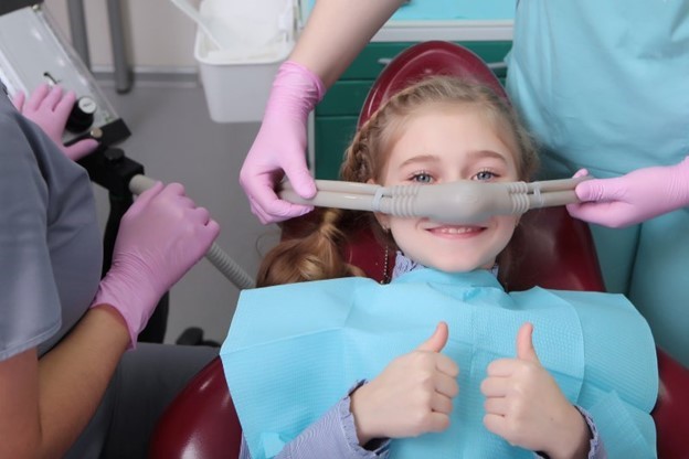 child at dentist receiving nitrous oxide sedation