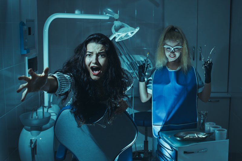 A woman hearing some scary dental statistics in a nightmare about a dentist